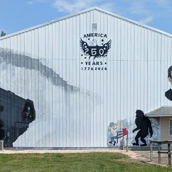 Just about half done, this is the mural so far on the side of Bob Howard’s Sandy Creek Construction building located at 104 S. Hill St. in Winchester. (Carmen Ensinger/River County News)